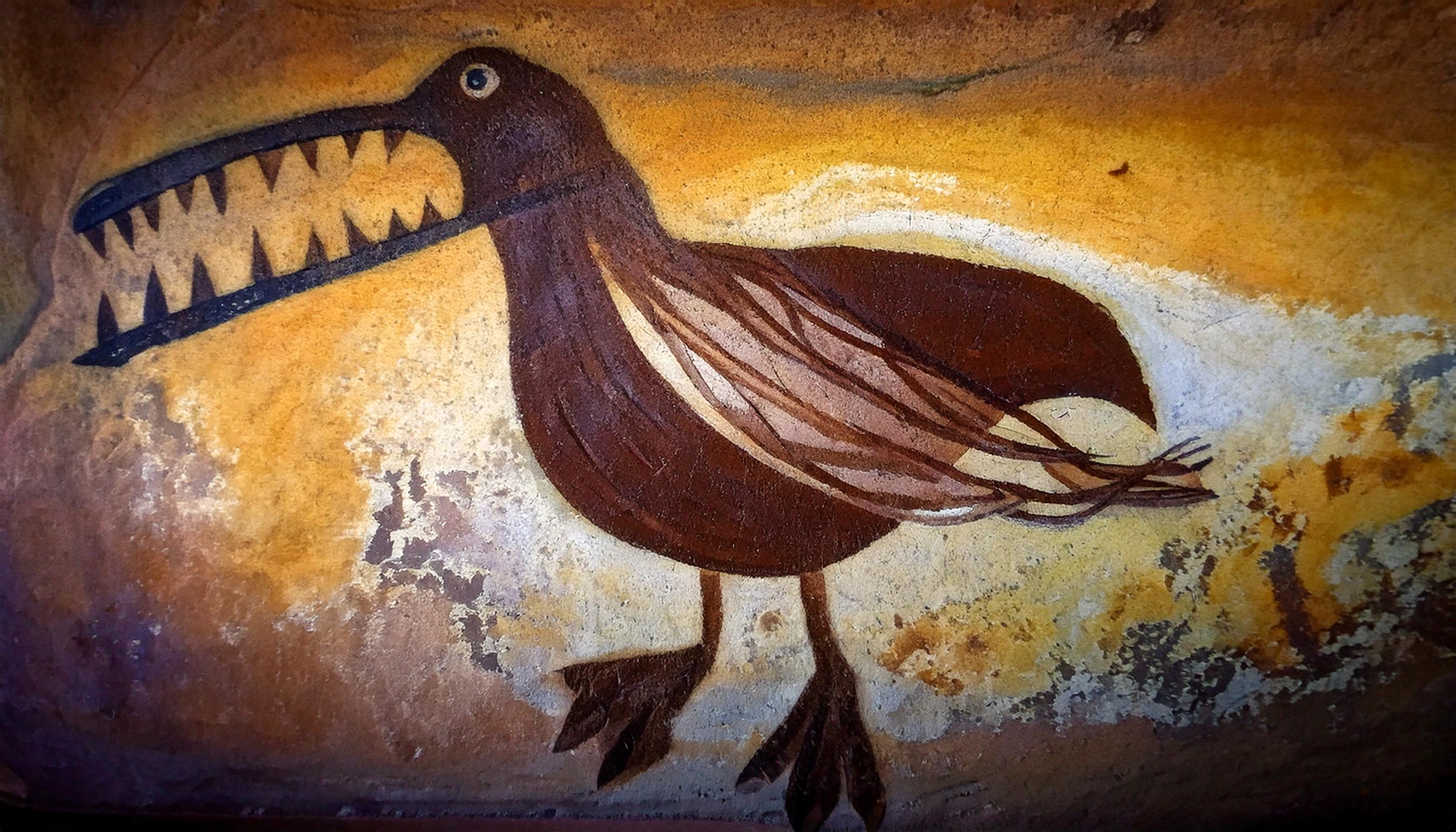 A cave painting of a Crocoduck, showing a crocodile-like head and body with duck-like wings and feet. Created by an early Floridian caveman a really long time ago.